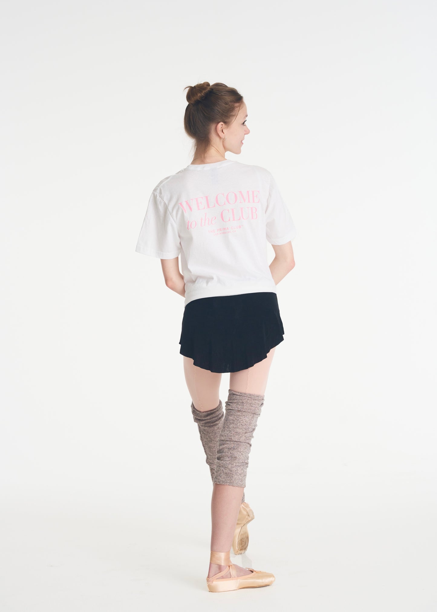 model facing away from camera wearing welcome to the club tee