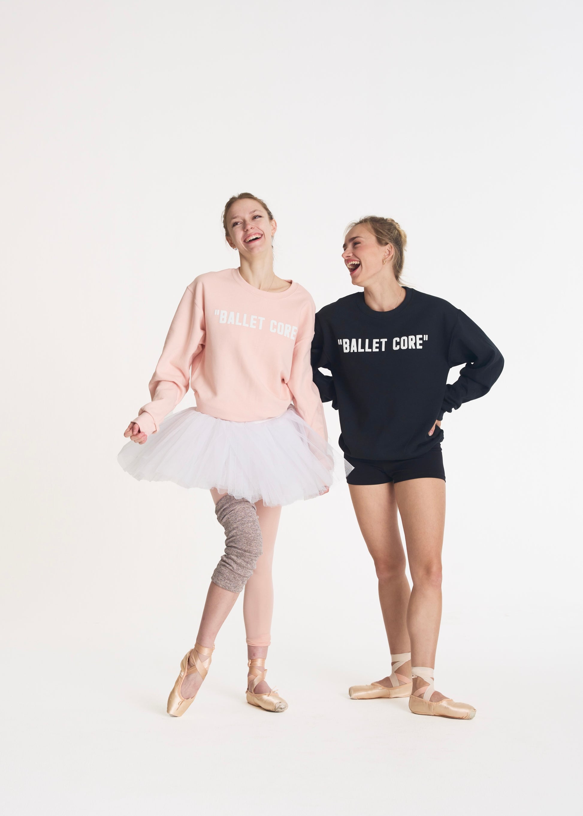 two models laughing while wearing ballet core crewnecks